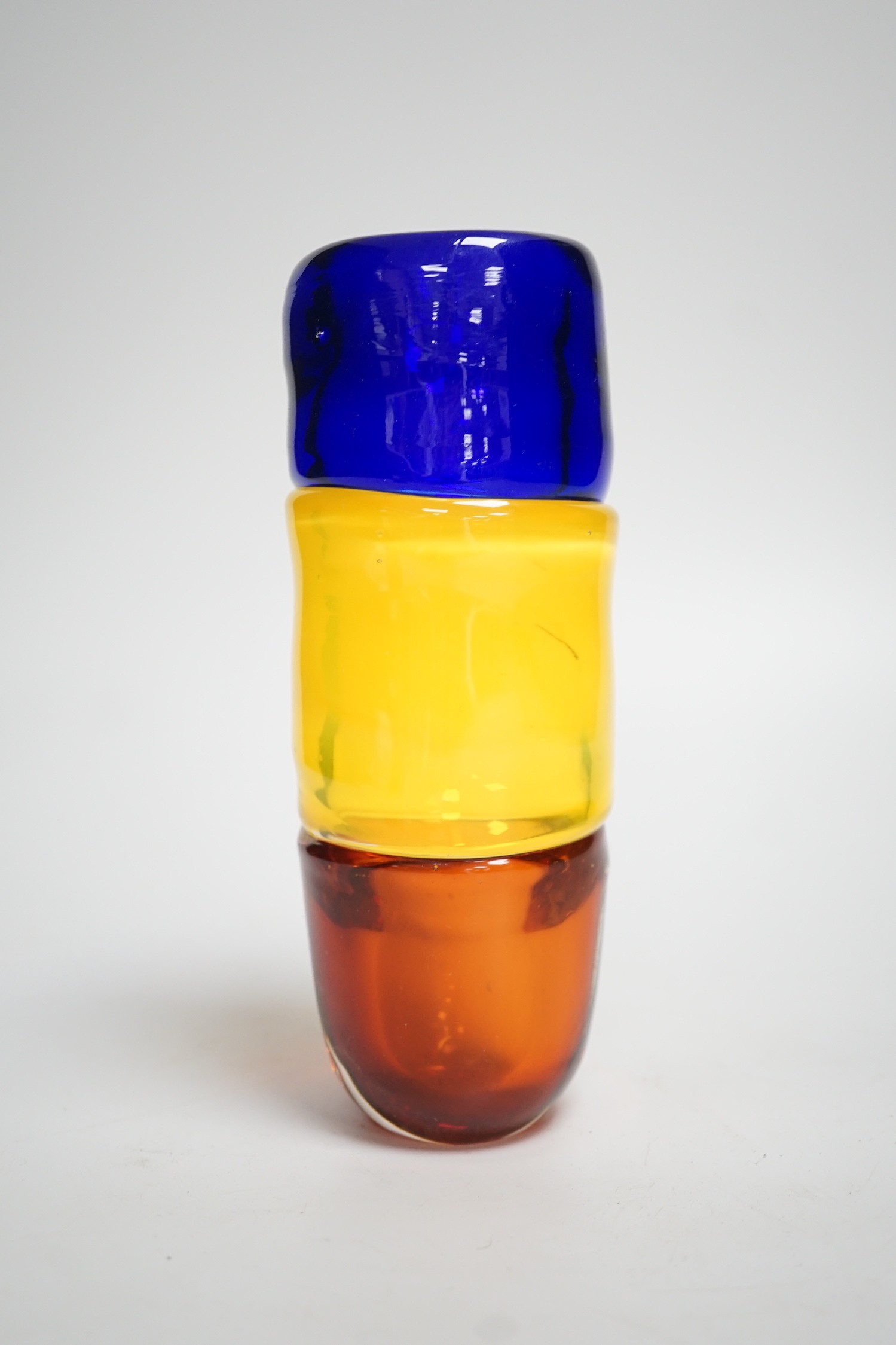 A signed Mike Frolich fused three colour glass vase. 19cm high